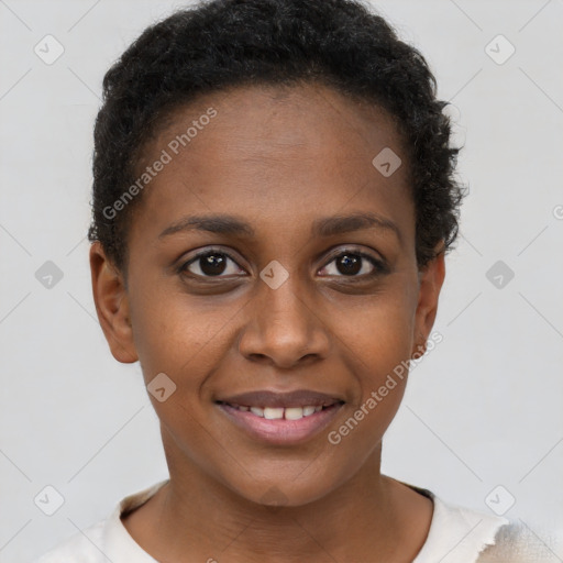 Joyful black young-adult female with short  brown hair and brown eyes