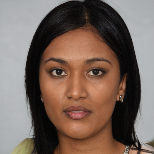 Joyful asian young-adult female with medium  black hair and brown eyes