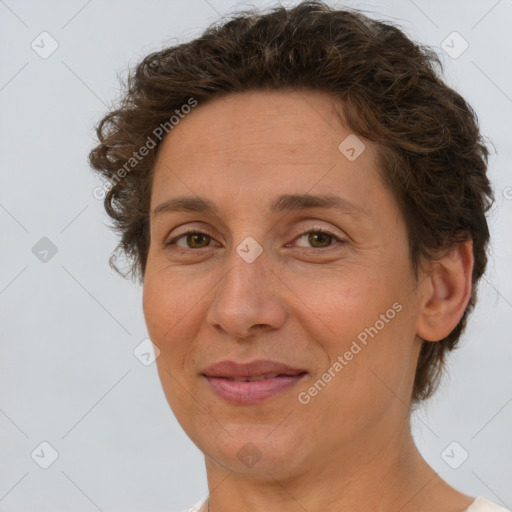 Joyful white adult female with short  brown hair and brown eyes