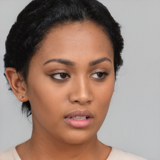 Neutral latino young-adult female with short  brown hair and brown eyes