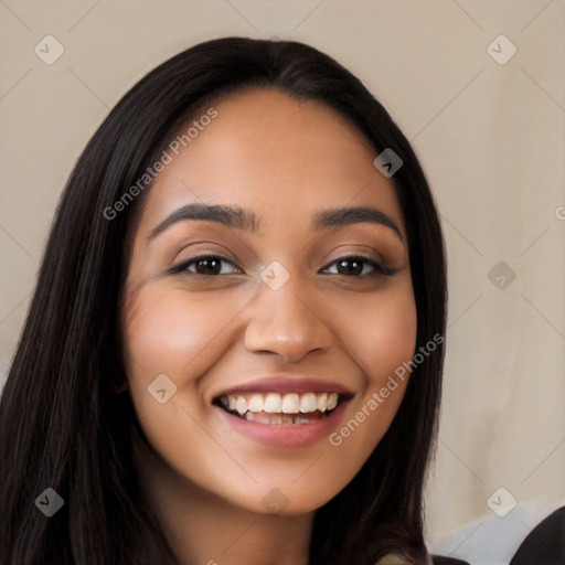 Joyful latino young-adult female with long  black hair and brown eyes