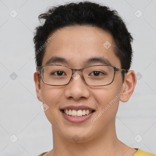 Joyful latino young-adult male with short  brown hair and brown eyes