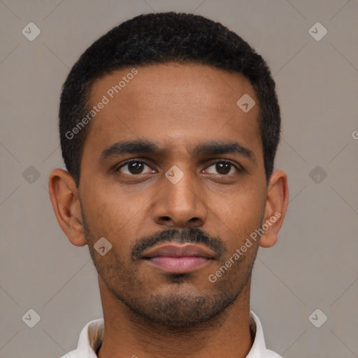 Neutral latino young-adult male with short  black hair and brown eyes