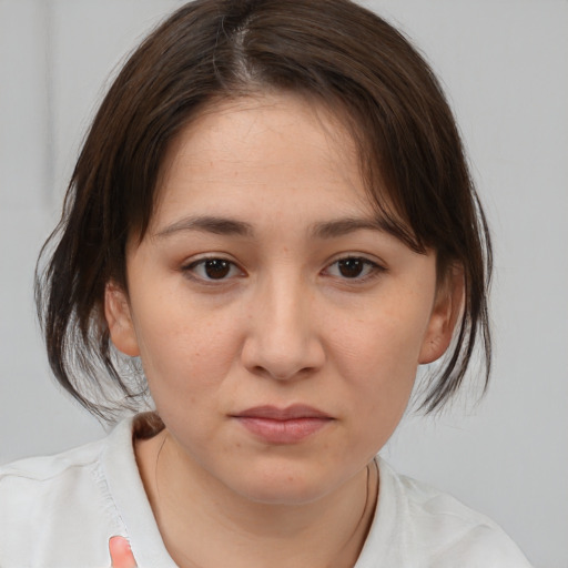 Neutral white young-adult female with medium  brown hair and brown eyes