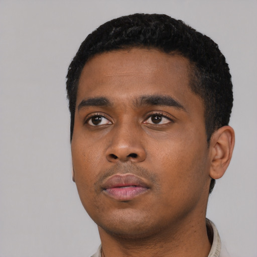 Neutral black young-adult male with short  black hair and brown eyes
