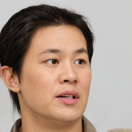 Neutral asian adult male with short  brown hair and brown eyes