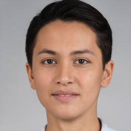 Joyful white young-adult male with short  black hair and brown eyes