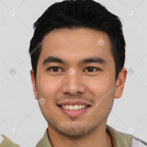 Joyful asian young-adult male with short  brown hair and brown eyes