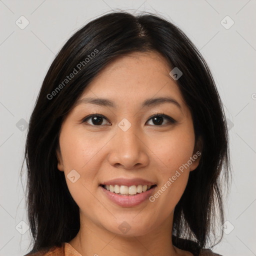 Joyful latino young-adult female with medium  brown hair and brown eyes