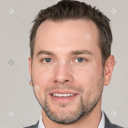 Joyful white young-adult male with short  brown hair and brown eyes