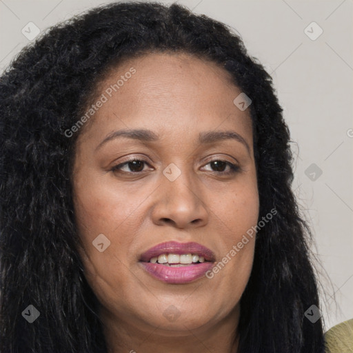 Joyful black young-adult female with long  brown hair and brown eyes