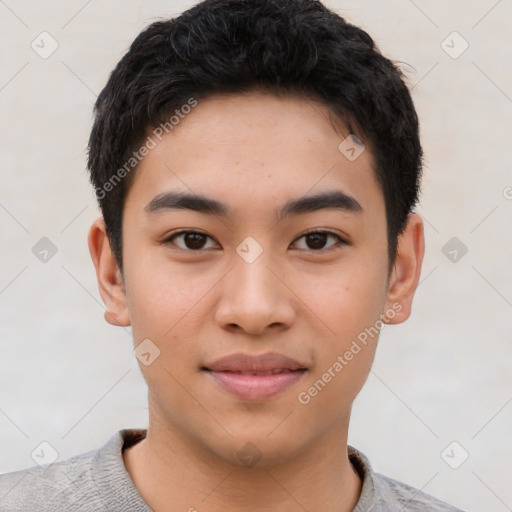 Joyful asian young-adult male with short  brown hair and brown eyes