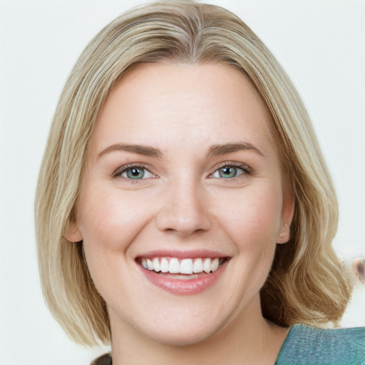 Joyful white young-adult female with medium  brown hair and green eyes