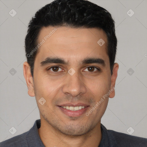 Joyful white young-adult male with short  black hair and brown eyes