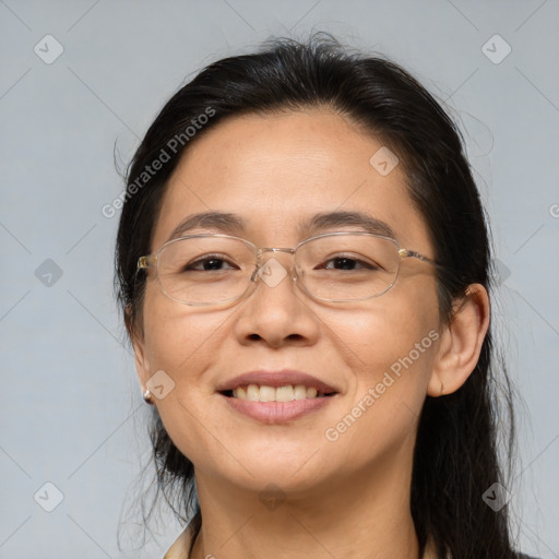 Joyful asian adult female with medium  brown hair and brown eyes