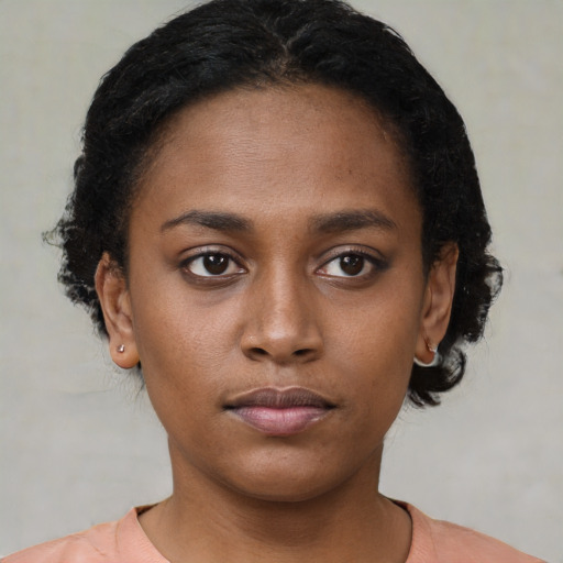 Neutral black young-adult female with short  brown hair and brown eyes