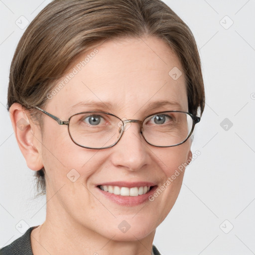 Joyful white adult female with medium  brown hair and blue eyes