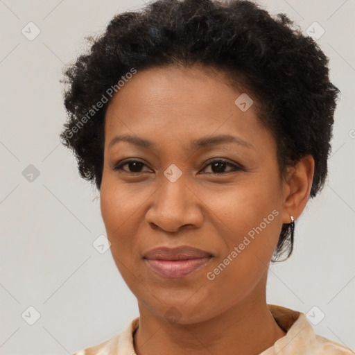 Joyful black adult female with short  brown hair and brown eyes