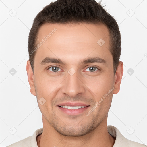 Joyful white young-adult male with short  brown hair and brown eyes