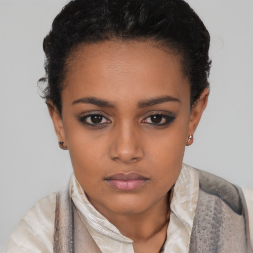 Neutral black young-adult female with short  black hair and brown eyes