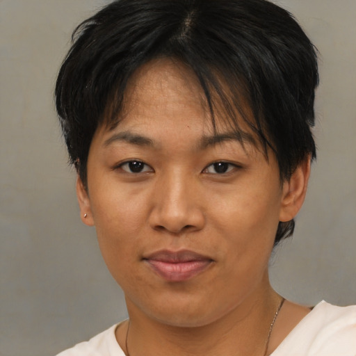 Joyful asian adult female with short  brown hair and brown eyes