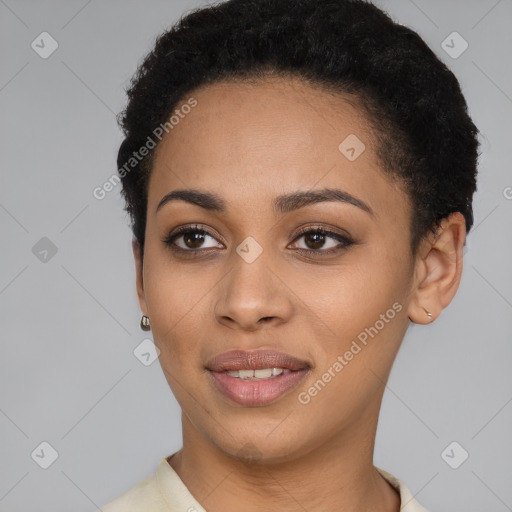 Joyful black young-adult female with short  brown hair and brown eyes