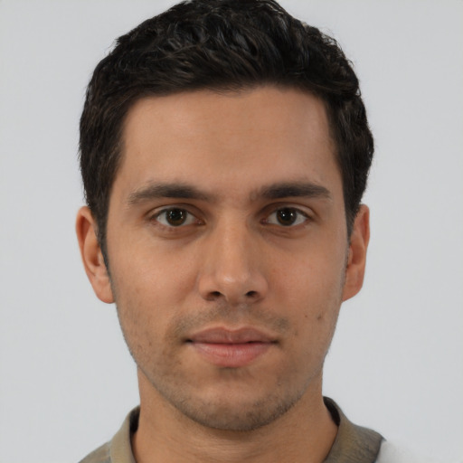 Neutral latino young-adult male with short  brown hair and brown eyes