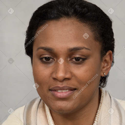 Joyful black young-adult female with short  brown hair and brown eyes