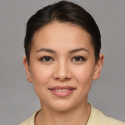 Joyful asian young-adult female with short  brown hair and brown eyes