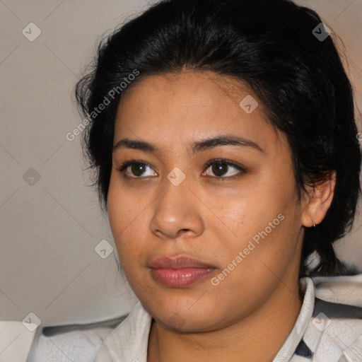 Joyful latino young-adult female with medium  black hair and brown eyes