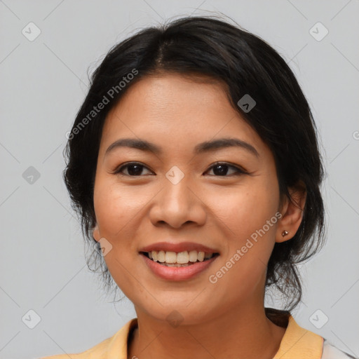 Joyful asian young-adult female with medium  black hair and brown eyes