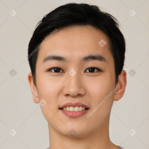 Joyful asian young-adult male with short  black hair and brown eyes