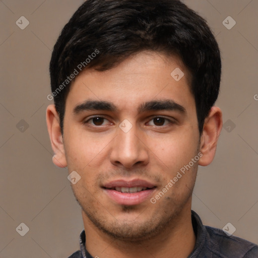 Joyful white young-adult male with short  black hair and brown eyes