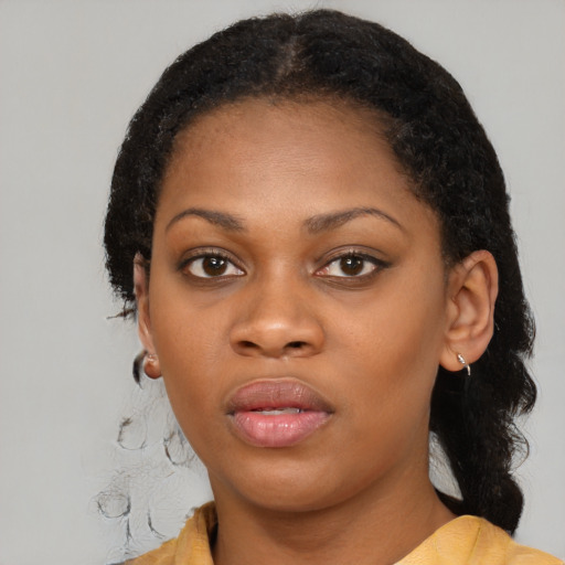 Neutral black young-adult female with medium  black hair and brown eyes