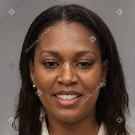 Joyful black young-adult female with long  brown hair and brown eyes