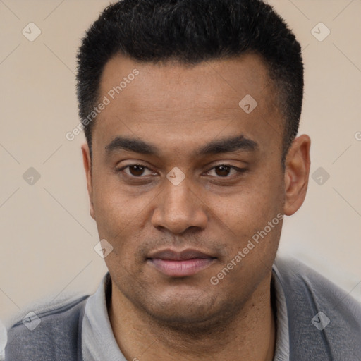 Joyful latino young-adult male with short  black hair and brown eyes