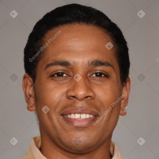 Joyful latino young-adult male with short  brown hair and brown eyes