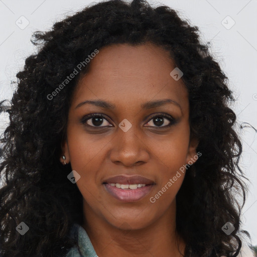 Joyful black young-adult female with long  brown hair and brown eyes