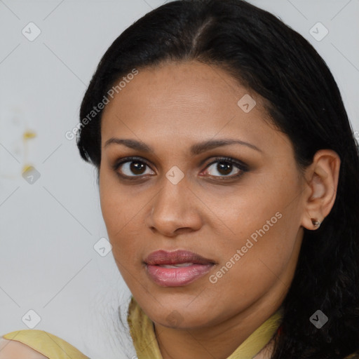 Joyful latino young-adult female with medium  brown hair and brown eyes