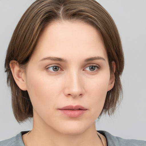 Neutral white young-adult female with medium  brown hair and grey eyes