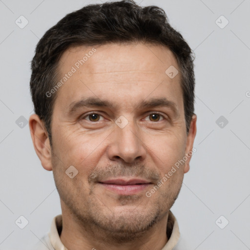 Joyful white adult male with short  brown hair and brown eyes