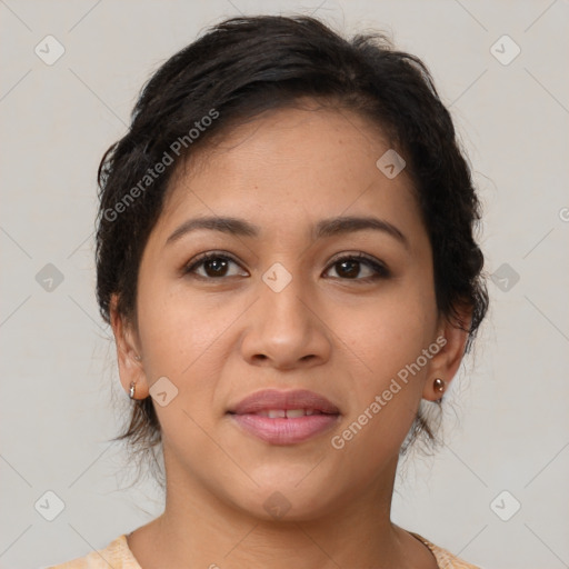 Joyful latino young-adult female with medium  brown hair and brown eyes