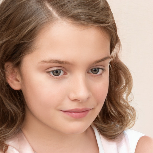 Joyful white child female with long  brown hair and grey eyes