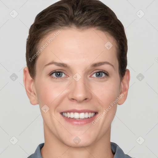 Joyful white young-adult female with short  brown hair and grey eyes