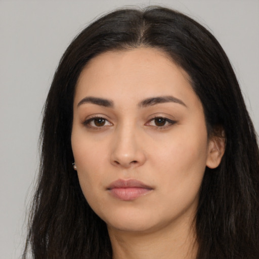 Neutral latino young-adult female with long  black hair and brown eyes