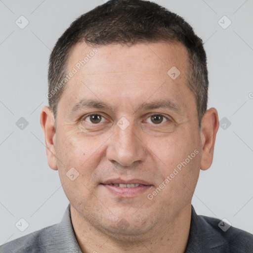 Joyful white adult male with short  brown hair and brown eyes