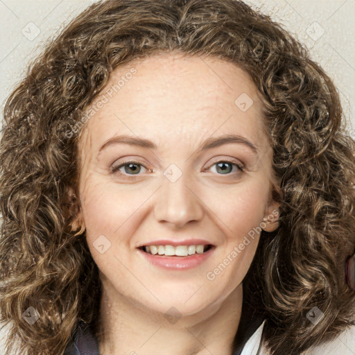 Joyful white young-adult female with long  brown hair and green eyes