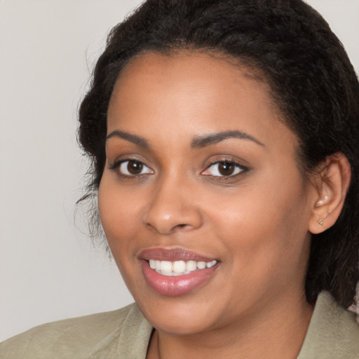 Joyful latino young-adult female with medium  black hair and brown eyes