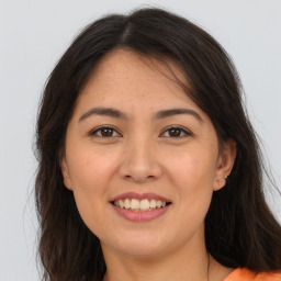 Joyful white young-adult female with long  brown hair and brown eyes