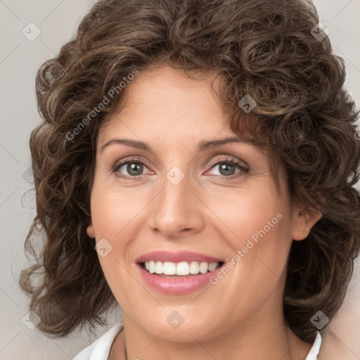 Joyful white young-adult female with medium  brown hair and green eyes